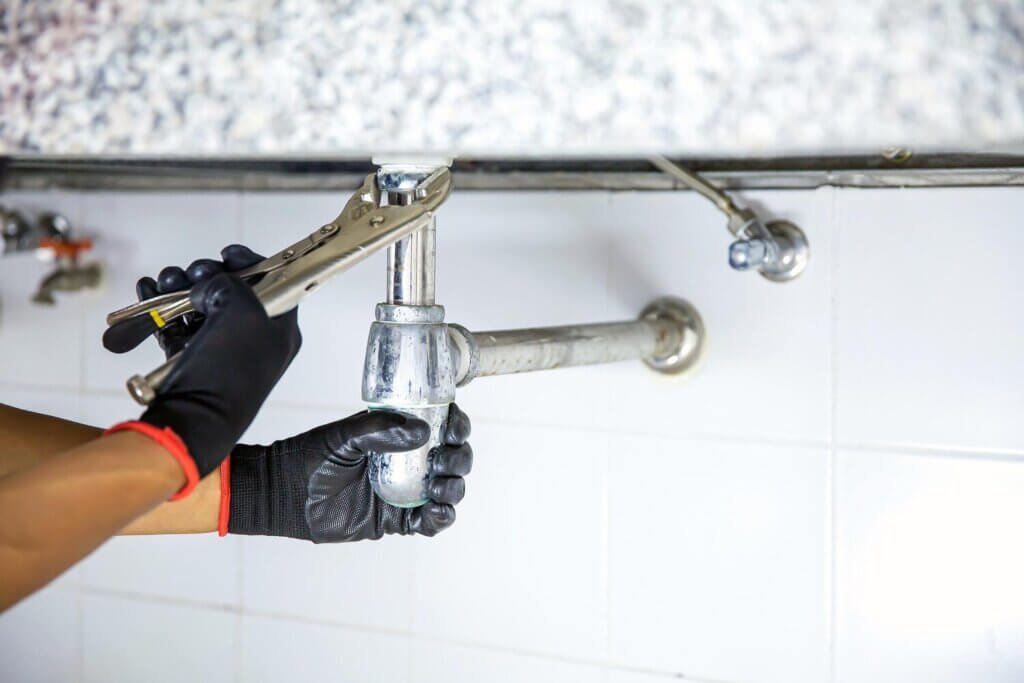 plumber using wrench repair water pipe sink 101448 4828 plumber using wrench repair water pipe sink 101448 4828